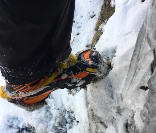 Scarpa Ribelle boots fitted with a crampon