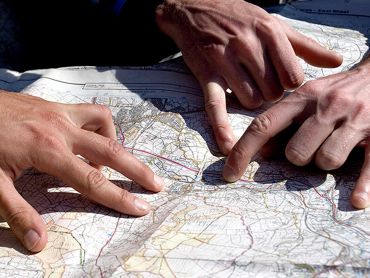 Hands on a map whilst learning to map read.