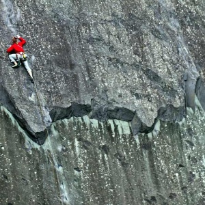 A rock climber climbing a multi pitch route.