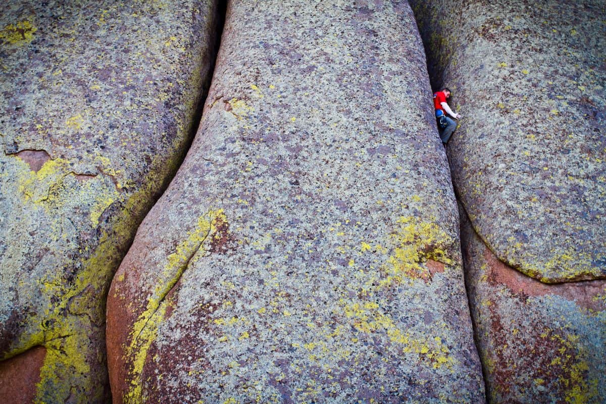 Pete Whittaker off width rock climbing at Vedauwoo, Wyoming in the USA. Photo by Alex Ekins