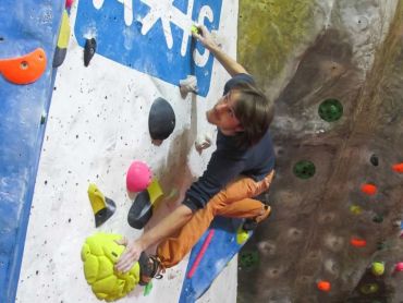 Climbing on a indoor climbing wall whilst on a Climbing Wall Instructor assessment