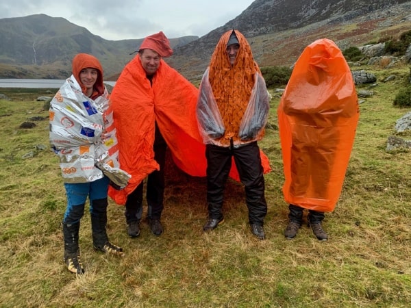 A range of emergency shelters being experimented with on a Mountain Leader Training course in Snowdonia.