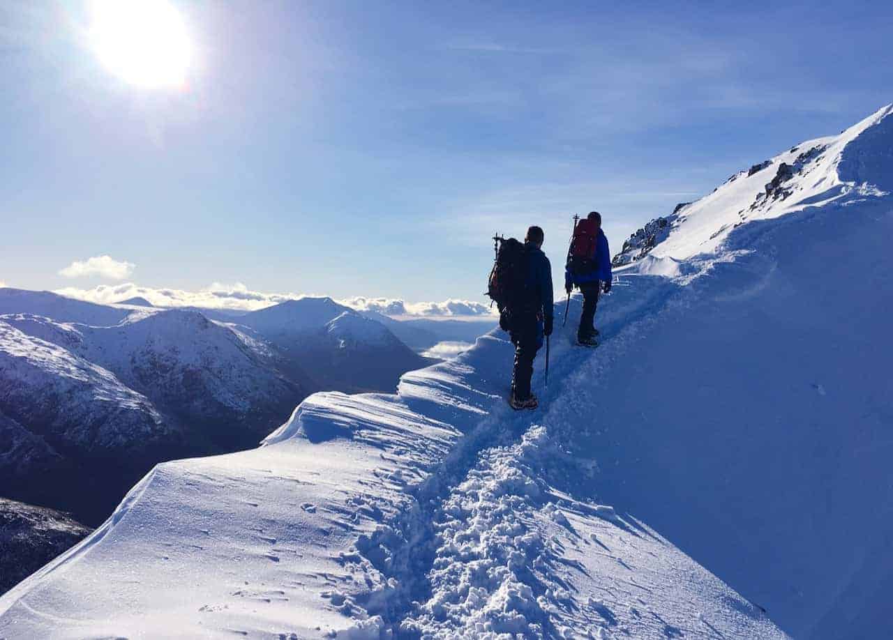 A winter skills course traverses a ridge in Scotland