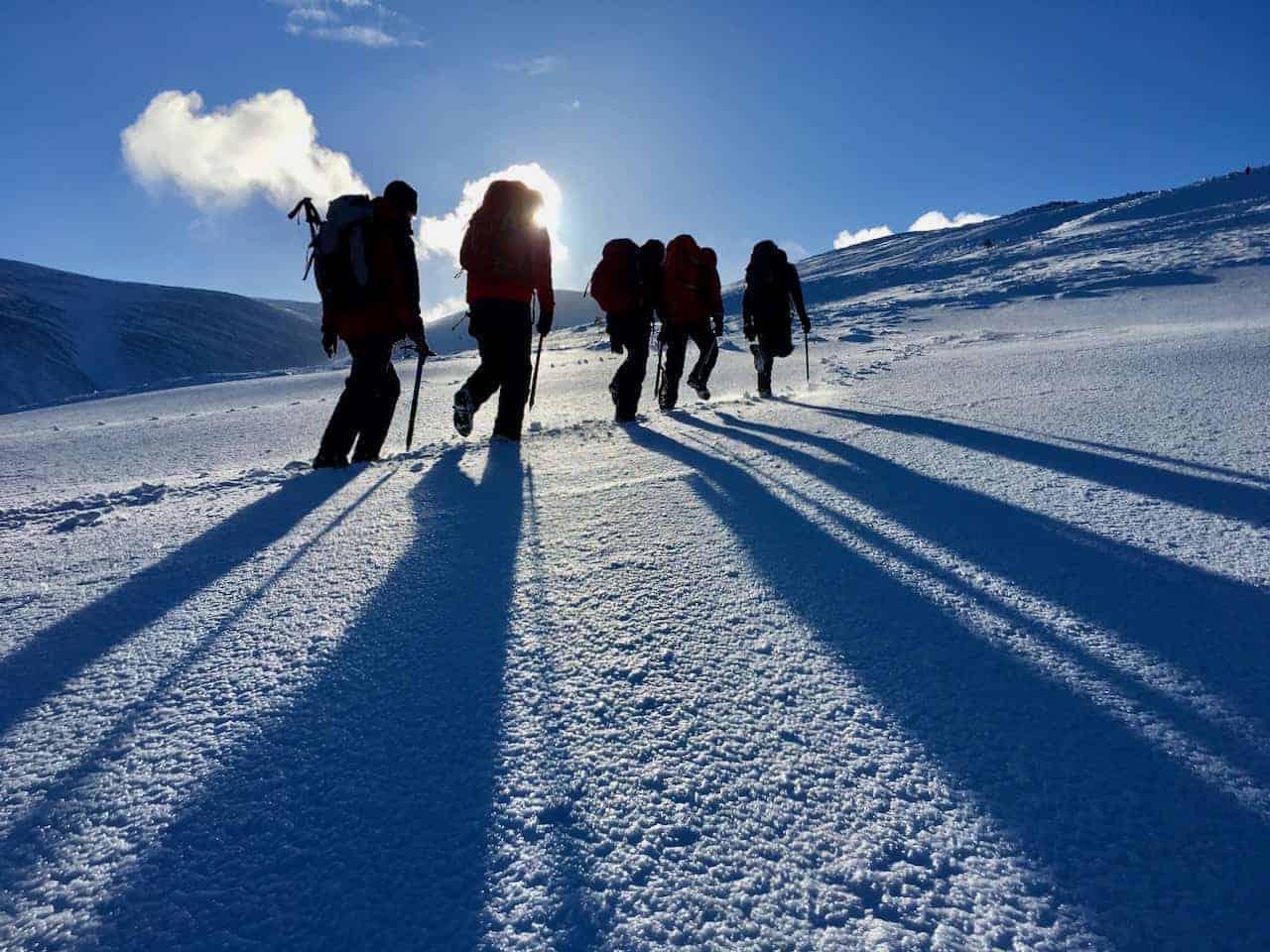 A winter skills course walking in snow in Scotland