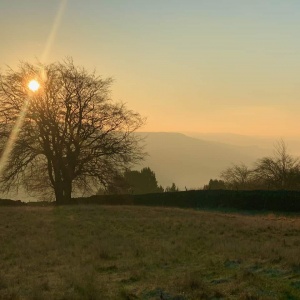 Sunrise over Froggatt Edge on a guided walking holiday in the Peak District.