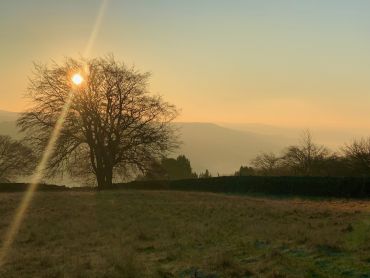 Sunrise over Froggatt Edge on a guided walking holiday in the Peak District.