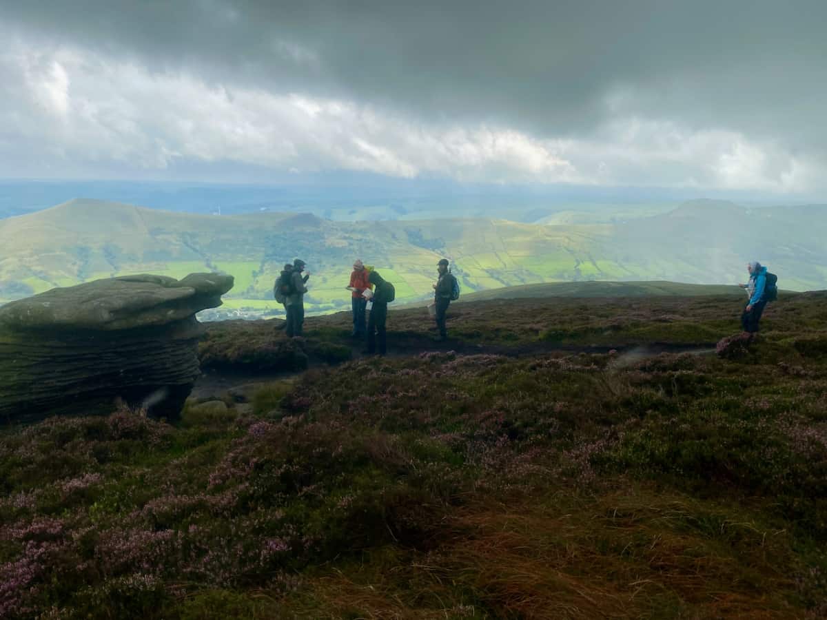 A walking group on Kinder Scout in the Peak District.