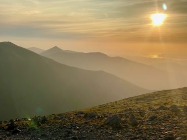 Sunset view of Snowdonia from Carnedd Dafydd on a Guided hillwalking course in Snowdonia.