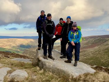 A walking group on the 9 Edges Challenge in the Peak District.