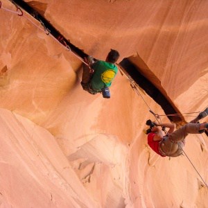 Alex Ekins photographing Ton Randall climbing Berry Full of Bad Berries in Indian Creek in Utah, USA © Pete Whittaker