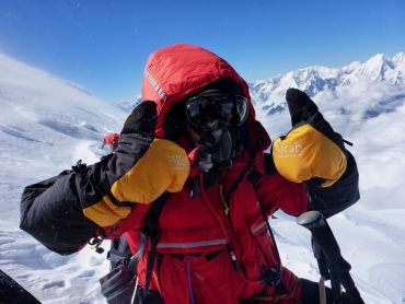 A man on a high altitude and remote expedition in Nepal climbing Manaslu