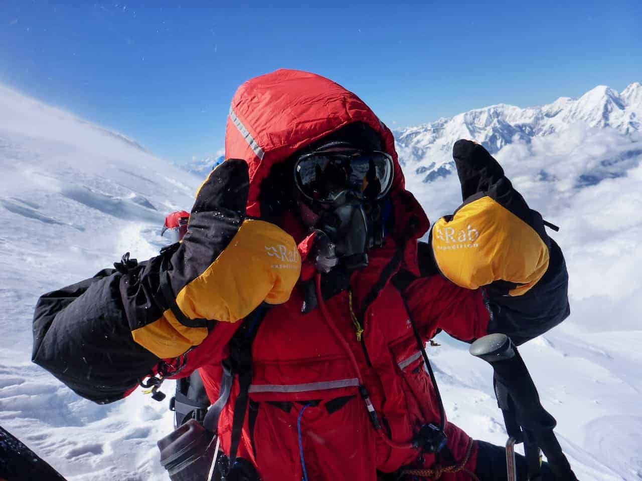 A man on a high altitude and remote expedition in Nepal climbing Manaslu
