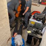 A group giving advanced first aid in a complex medical scenario