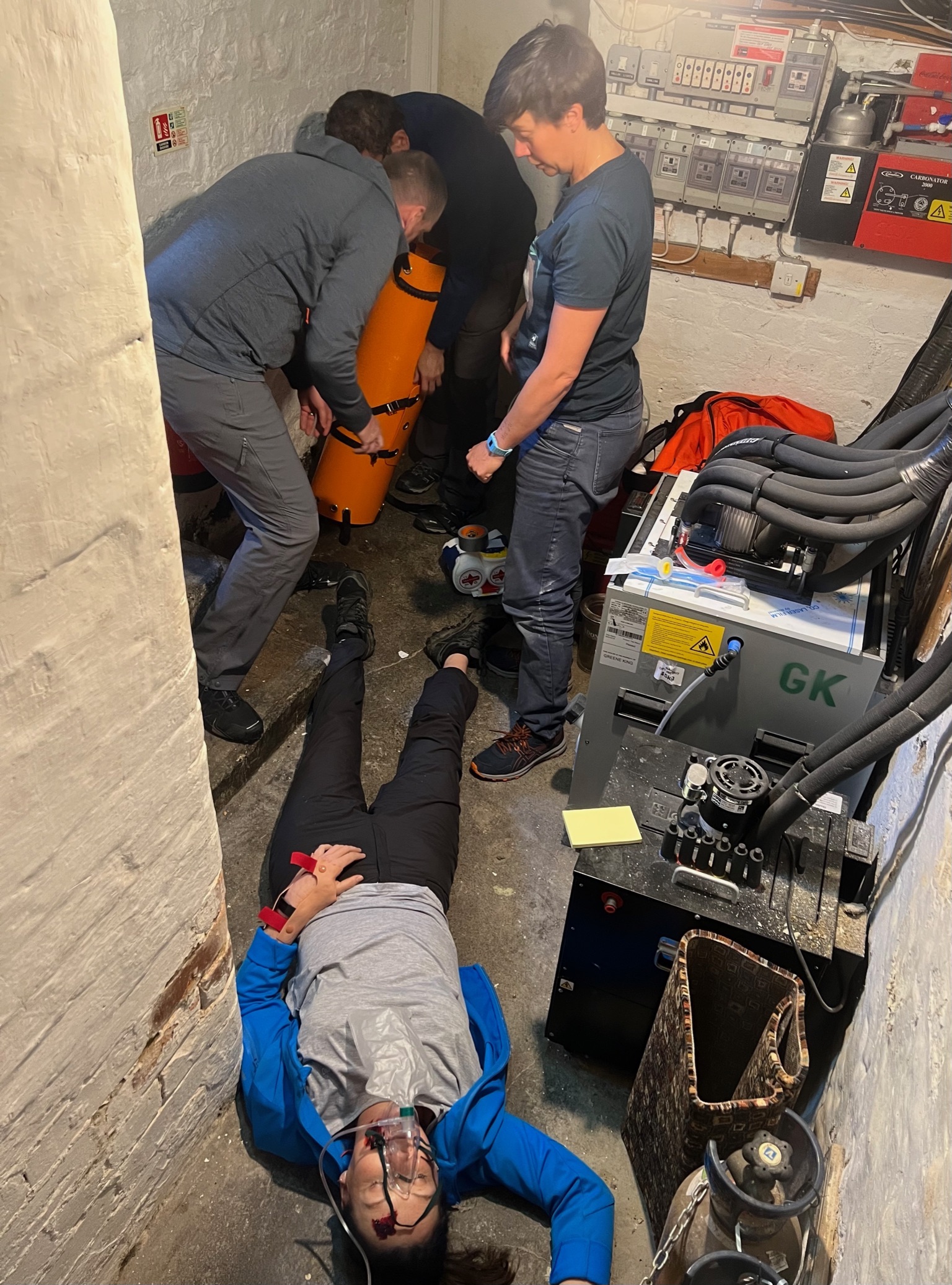 A group giving advanced first aid in a complex medical scenario