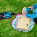 Delivering CPR on an outdoor first aid course in the Peak District