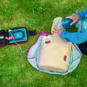 Delivering CPR on an outdoor first aid course in the Peak District