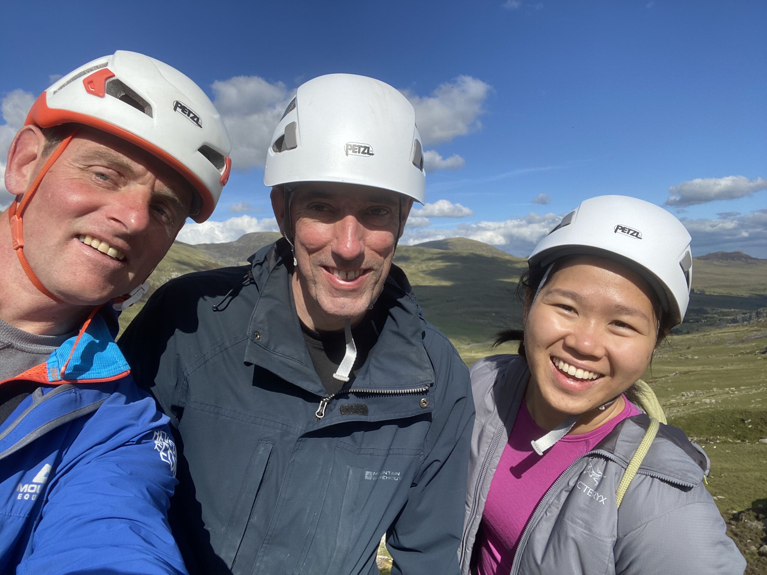 A group smiling on a Mountain Skills course