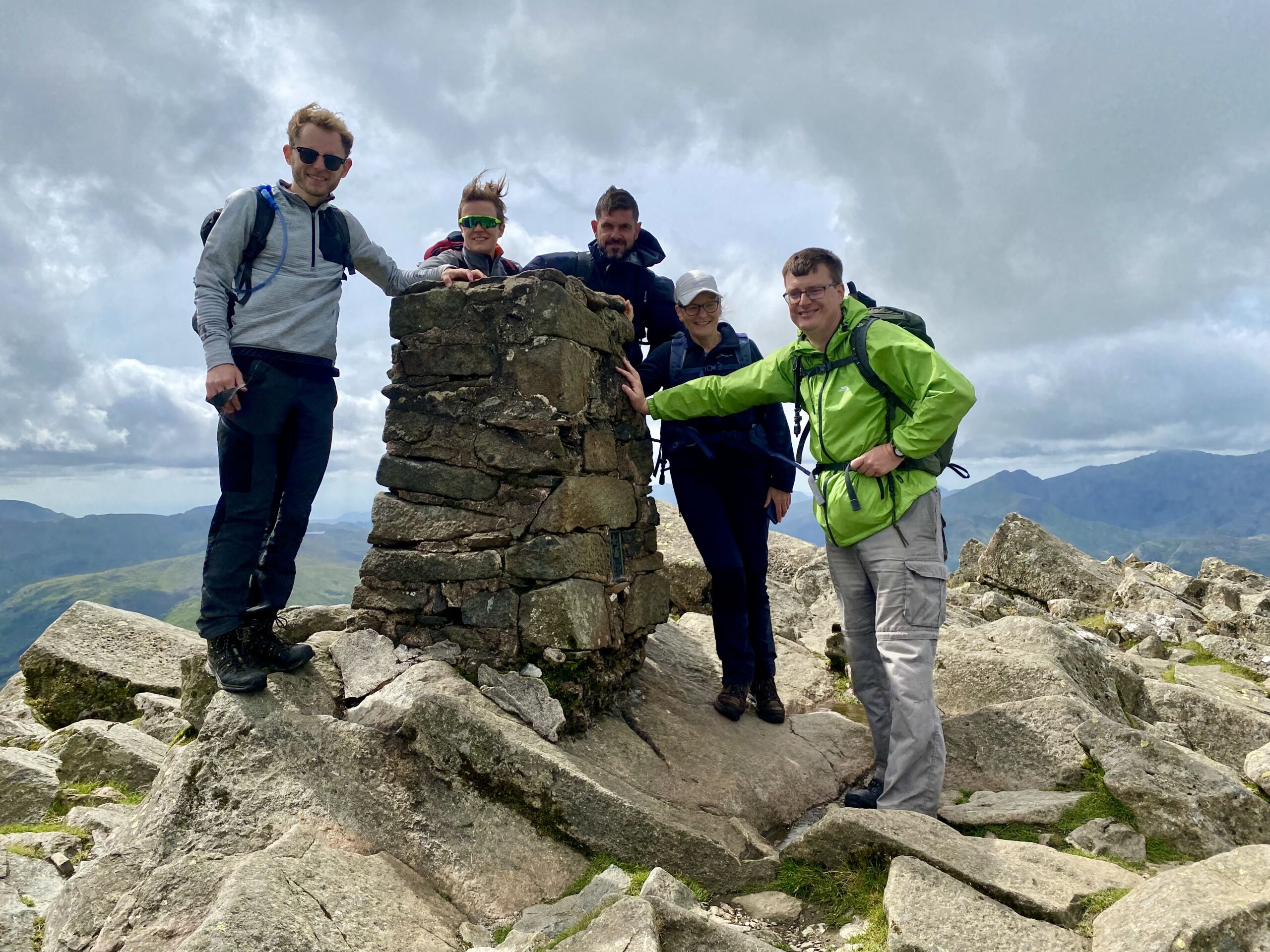 A group stands onto of Moel Siabod on a Mountain Skills course
