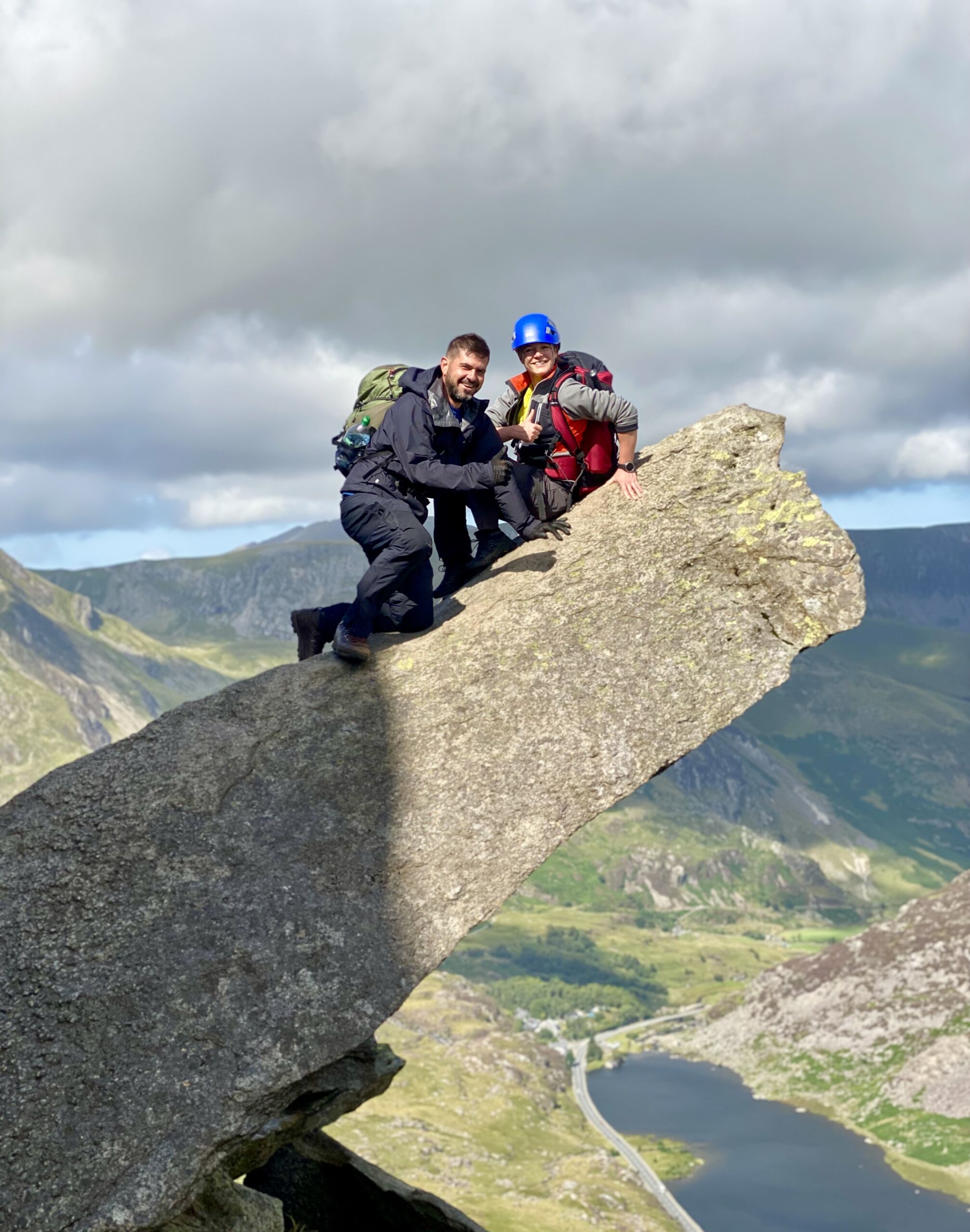 A man and woman on Canon rock on Tryfan on a Mountain Skills course
