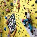A climbing wall development instructor, leading a climb