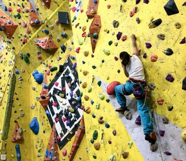 A climbing wall development instructor, leading a climb