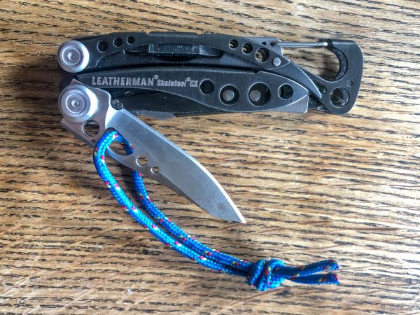 Leatherman Skeletool CX with cord attached for use with gloves and mitts