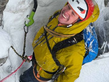 An ice climber on a Beyond the Edge winter mountaineering course in Glencoe, Scotland.