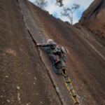 Climbing a slab with a cloth ladder