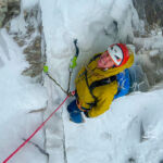 A winter climber, with ice axes in Scotland.