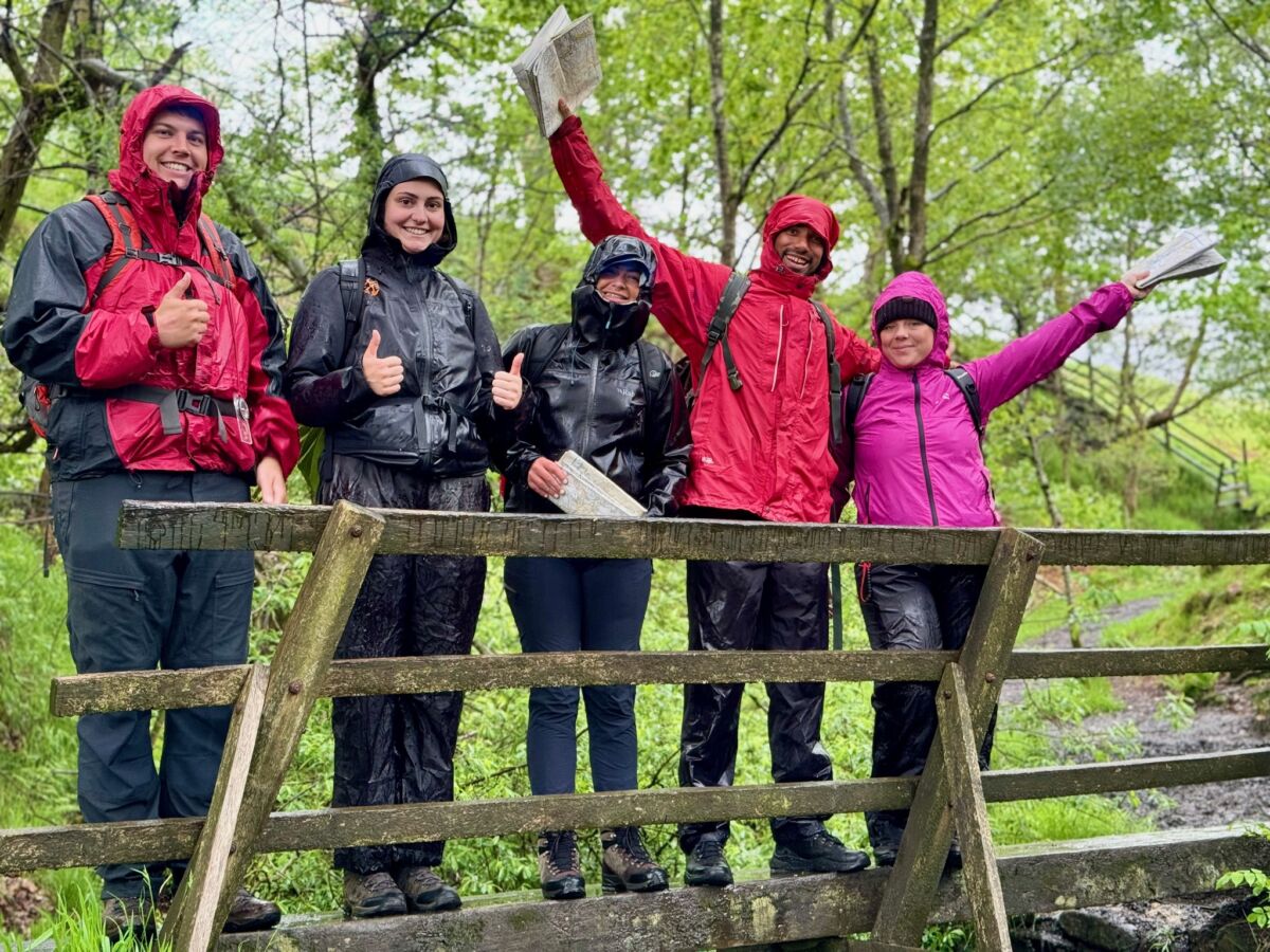 A group learning navigation on a hill skills course in Edale in the Peak District