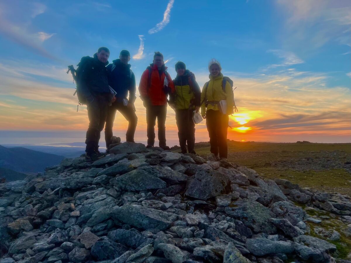 A group on a Mountain Leader course at sunset in the Carneddau.