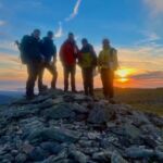 A group on a Mountain Leader course at sunset in the Carneddau.