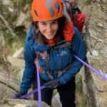 A woman abseils down Tryfan on a Mountain Leader assessment course.