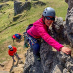 Two ladies learning to lead climb in the Peak District.
