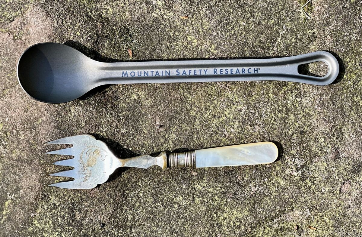 two spoons used on Mountain Leader expeditions. A antique silver spoon and a modern MSR titanium camping spoon