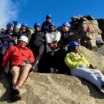 A group of ladies on Burbage edge whilst on a rock climbing course in the Peak District.