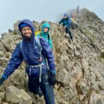A group scrambling across Crib Coch ridge in Eryri whilst on a scrambling course with Beyond the Edge.