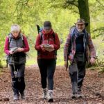 A group walking down a path in Chatsworth on a Lowland Leader assessment.
