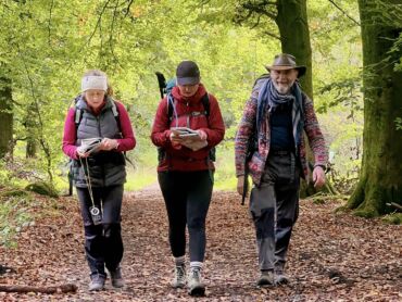 A group walking down a path in Chatsworth on a Lowland Leader assessment.