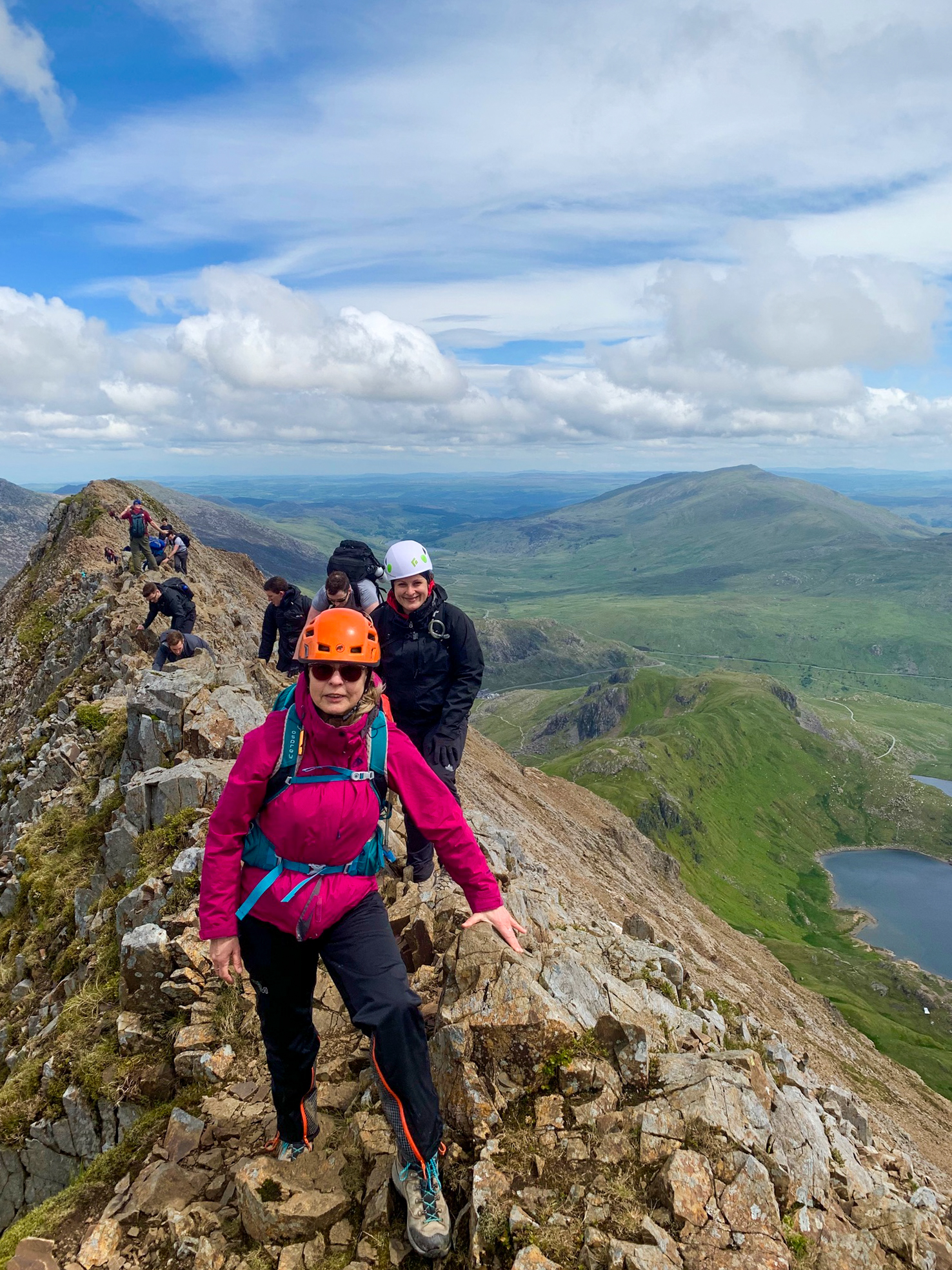 A group scrambling across Crib Coch ridge in Eryri whilst on a scrambling course with Beyond the Edge.