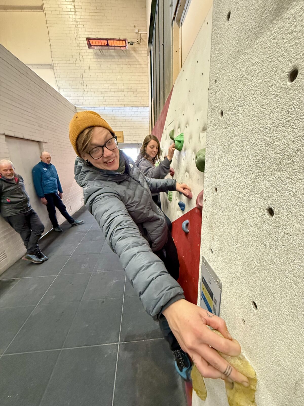 A lady practicing on a climbing wall instructor course in Sheffield.