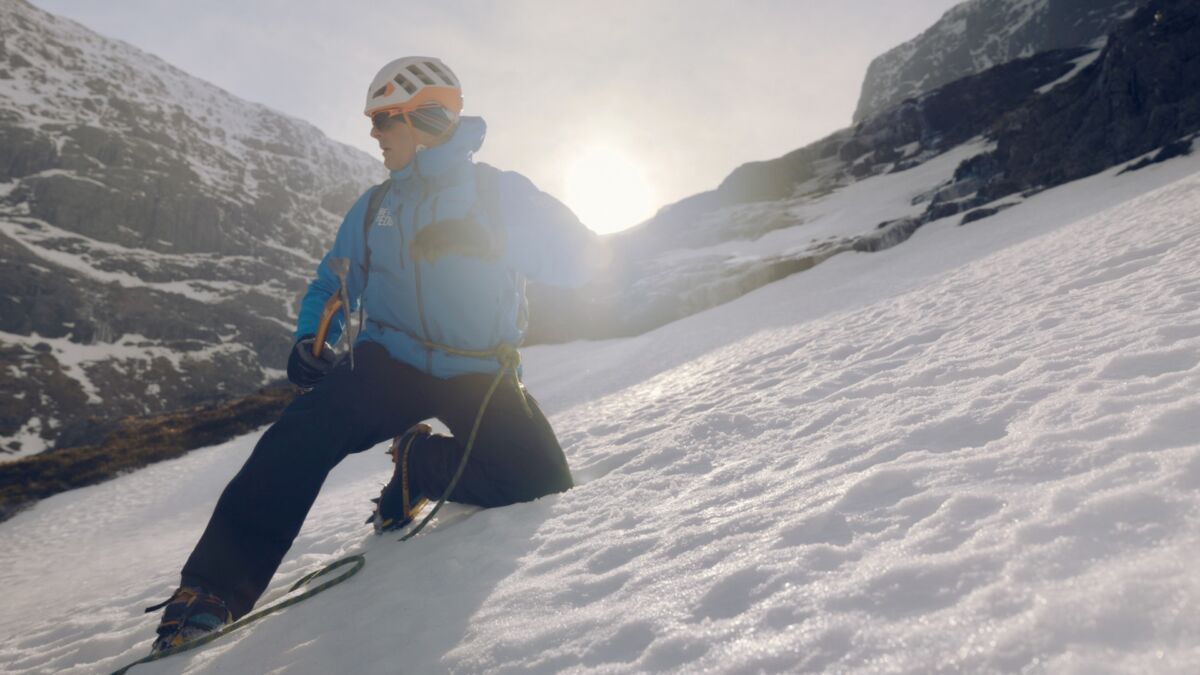 A man teaching snowdrift whilst on an Introduction to Winter Mountaineering course.