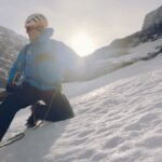 A man teaching snowdrift whilst on an Introduction to Winter Mountaineering course.
