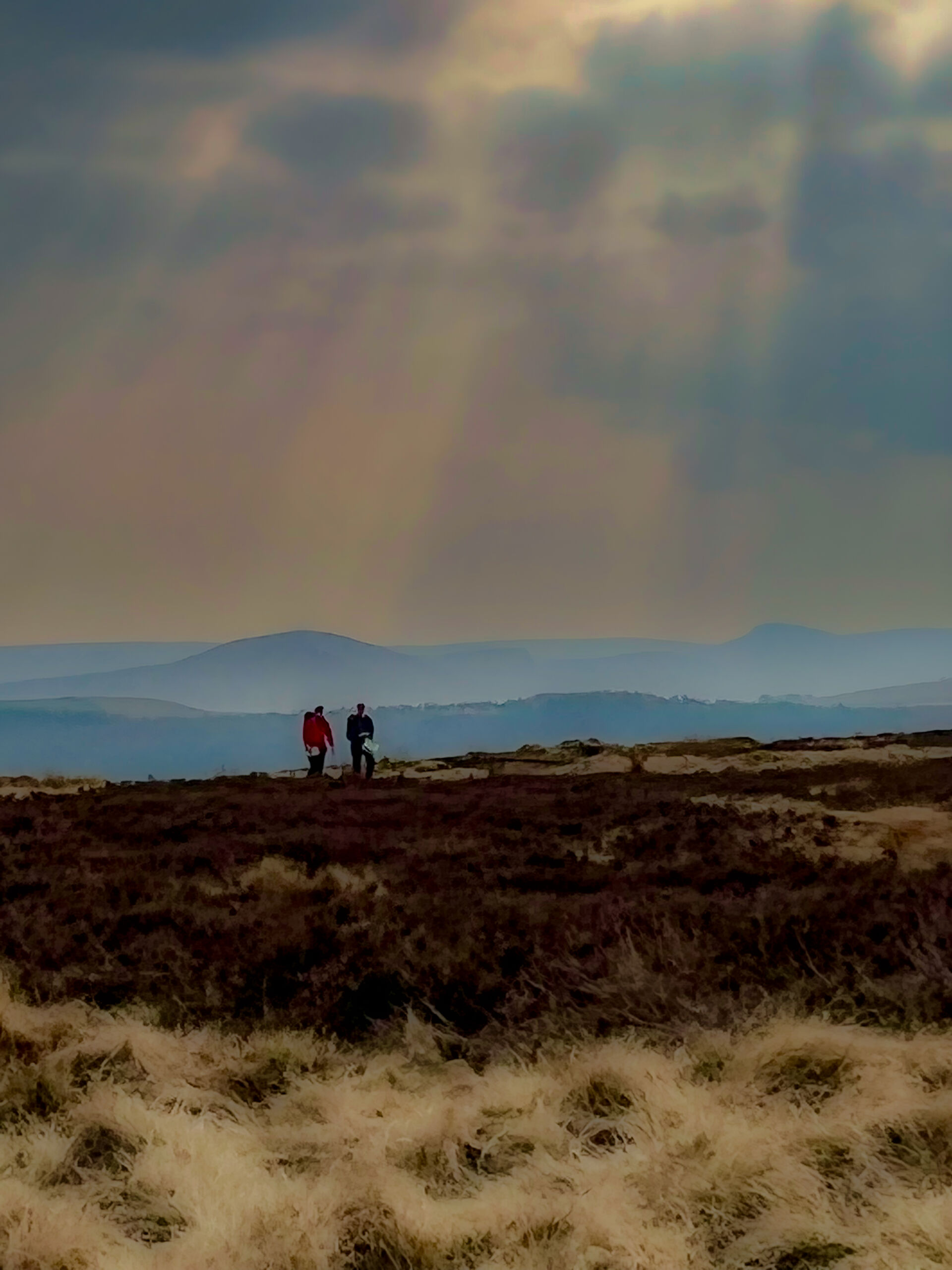 Two people navigating across moorlands whilst on a Hill and Moorland leader training course