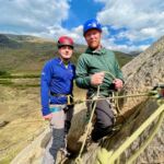 Two men tied to a rope on Little Tryfan in Eryri whilst on an Advanced Scrambling course.