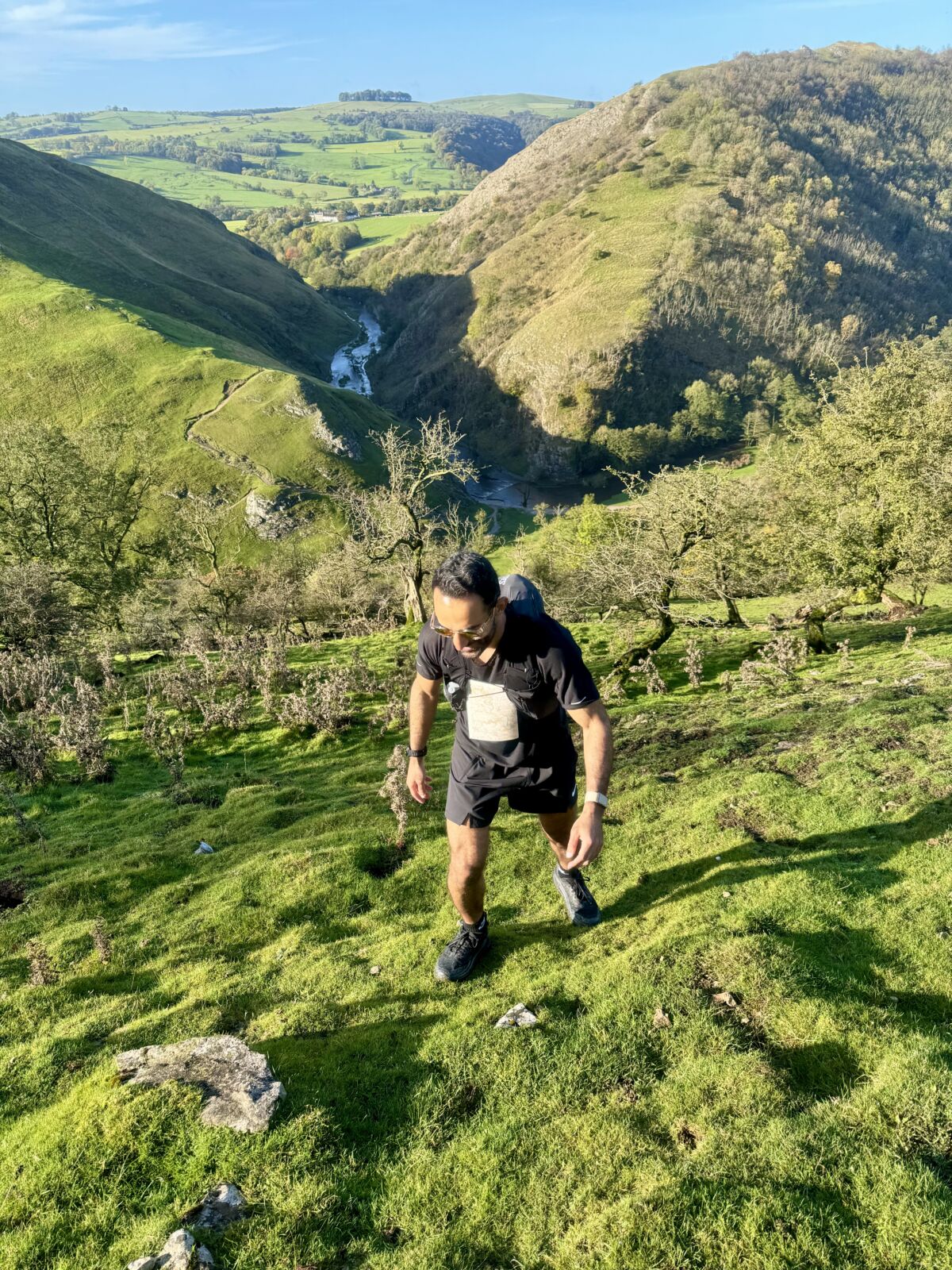 A man ascends a hill on a Trail running course in the Peak District.
