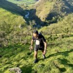 A man ascends a hill on a Trail running course in the Peak District.