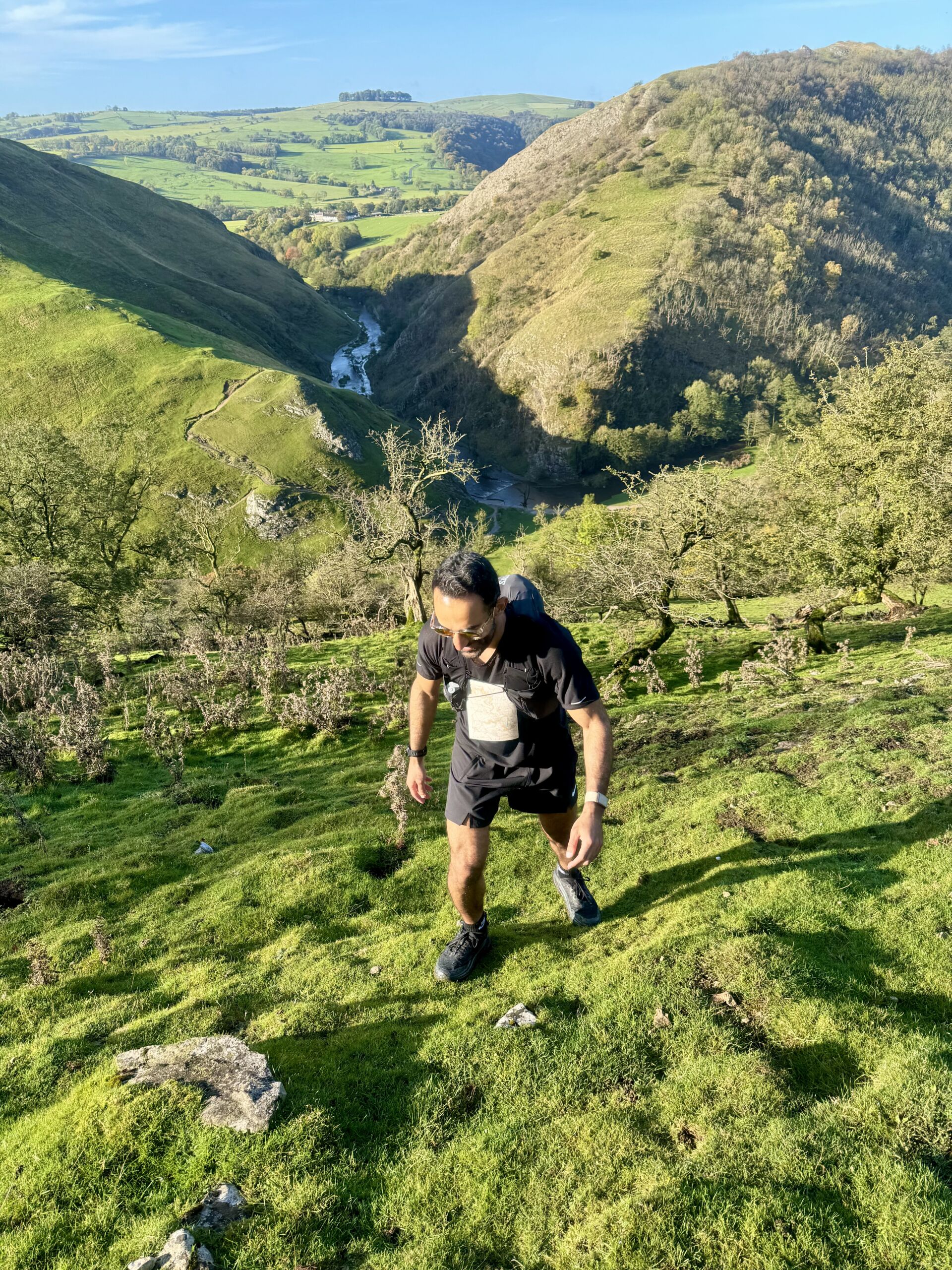 A man ascends a hill on a Trail running course in the Peak District.