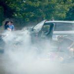 A group practicing advanced first aid in a car crash scenario
