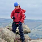 A lady practicing a South African abseil for her Mountain Skills.